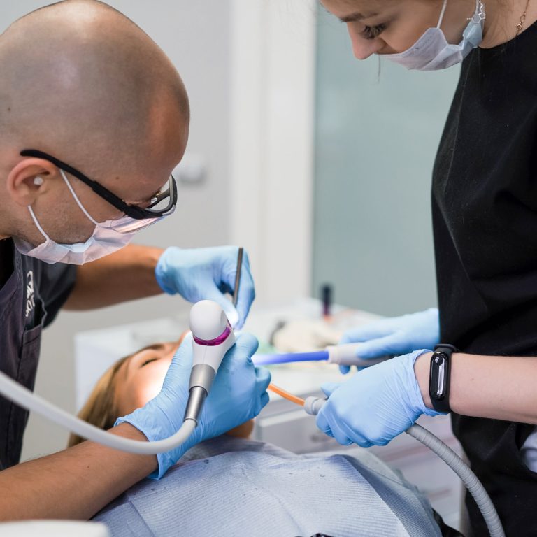 dentist in the process. Dental services, dental office, dental treatment.