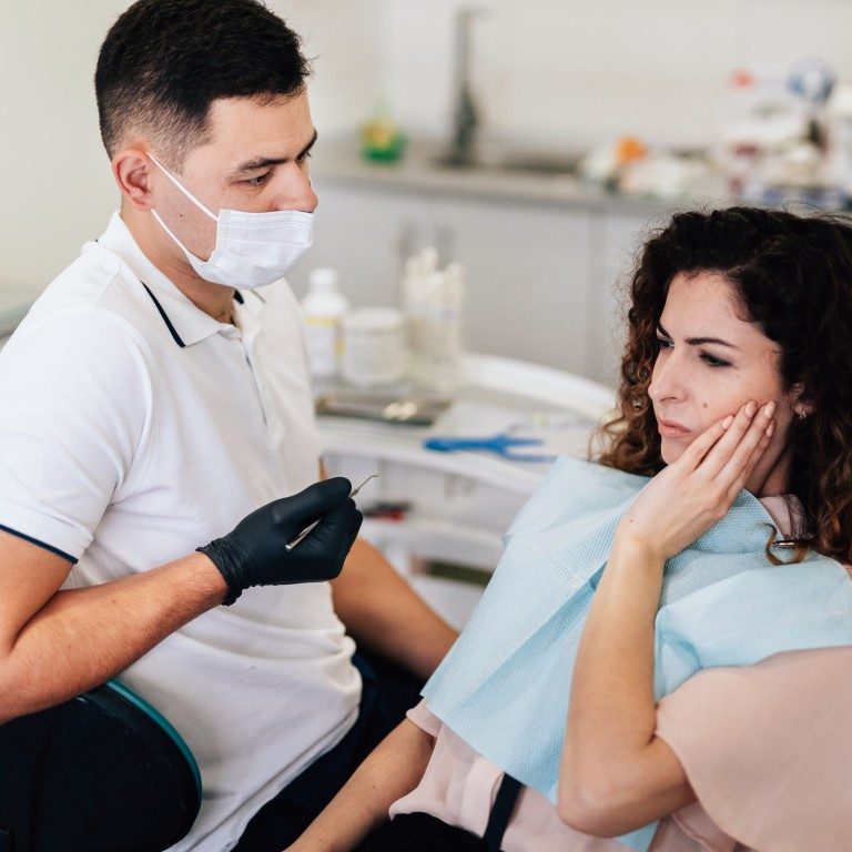 woman-with-toothache-dentist (Medium)